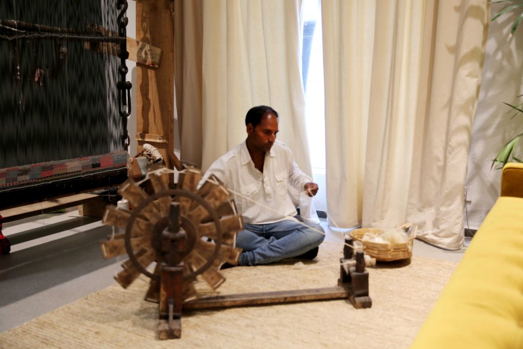 Madanlal from Aaspura Village with a spinning wheel